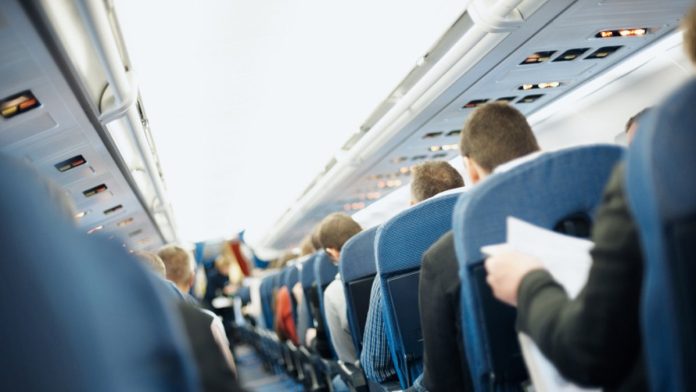 Flight passenger asks who controls entertainment center for extra seat, ignites etiquette debate