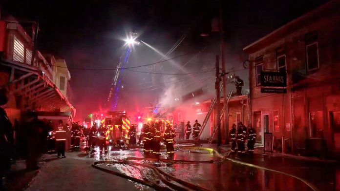 Massive blaze engulfs historic New England wharf; firefighters race to contain flames