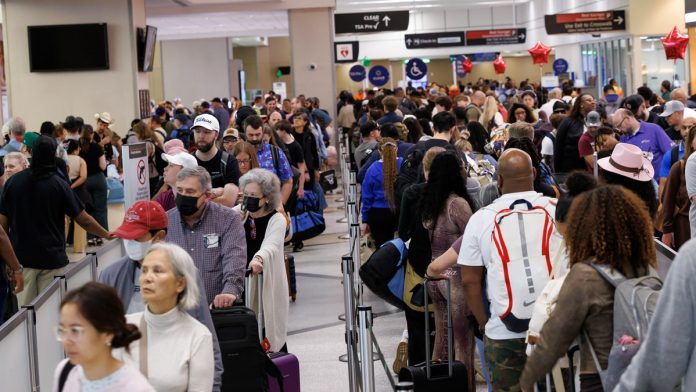 Shutdown sparks flight chaos as TSA lines spill into parking lots with 3-hour waits or longer